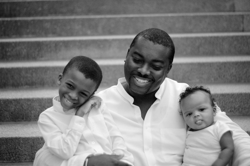 Emeka with his sons on the steps