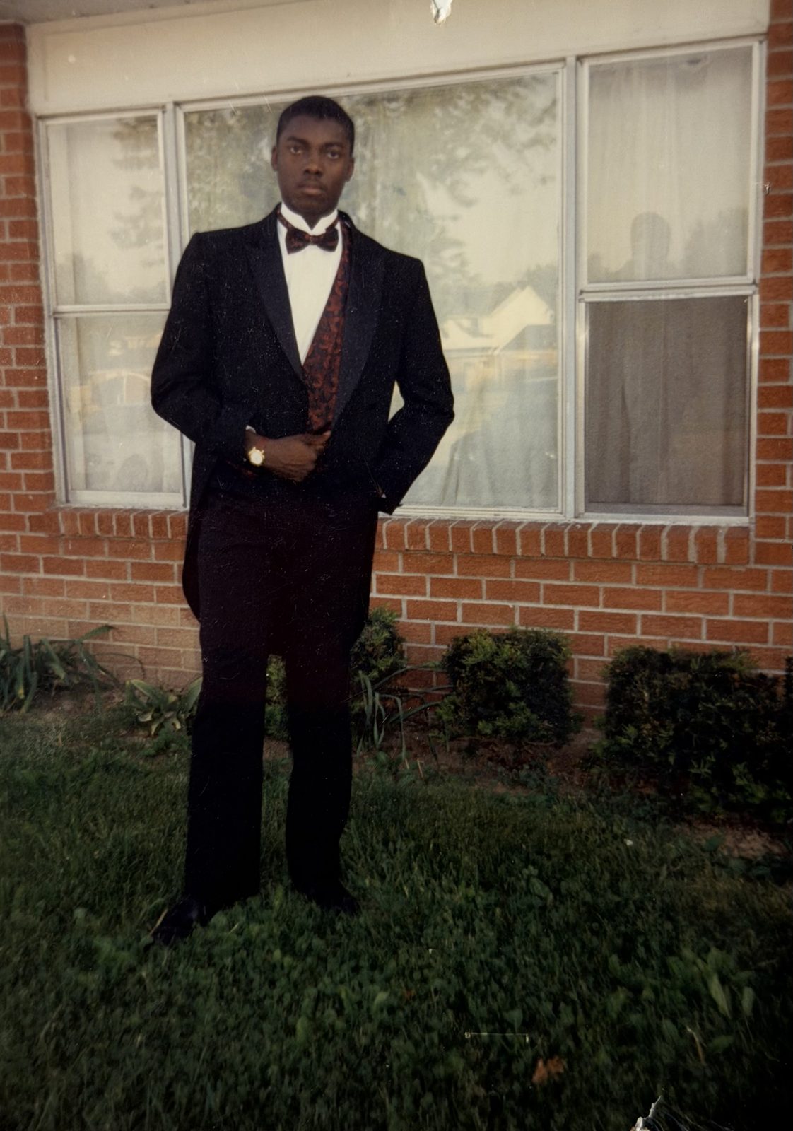 A young Emeka in a suit